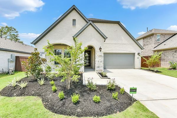 Front yard and exterior of 13015 Soaring Forest Dr